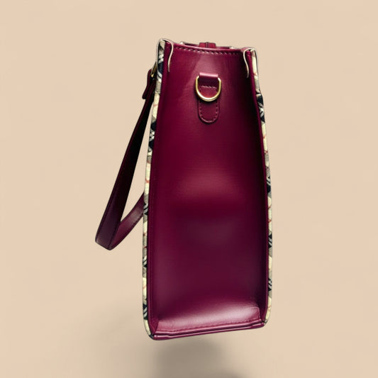 Graciza Nova Tote in maroon faux leather with checkered side panels, gold hardware, and an adjustable shoulder strap.