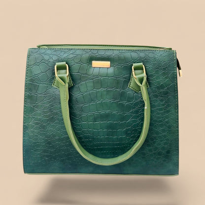 Graciza Lyra green faux leather handbag with crocodile texture and gold hardware. Top handles and zip closure.