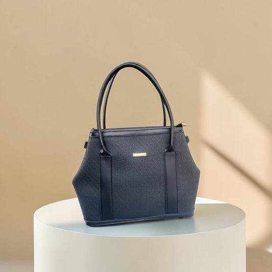 Graciza black Aero shoulder bag with flared wings, faux leather texture, and minimalist gold bar hardware.