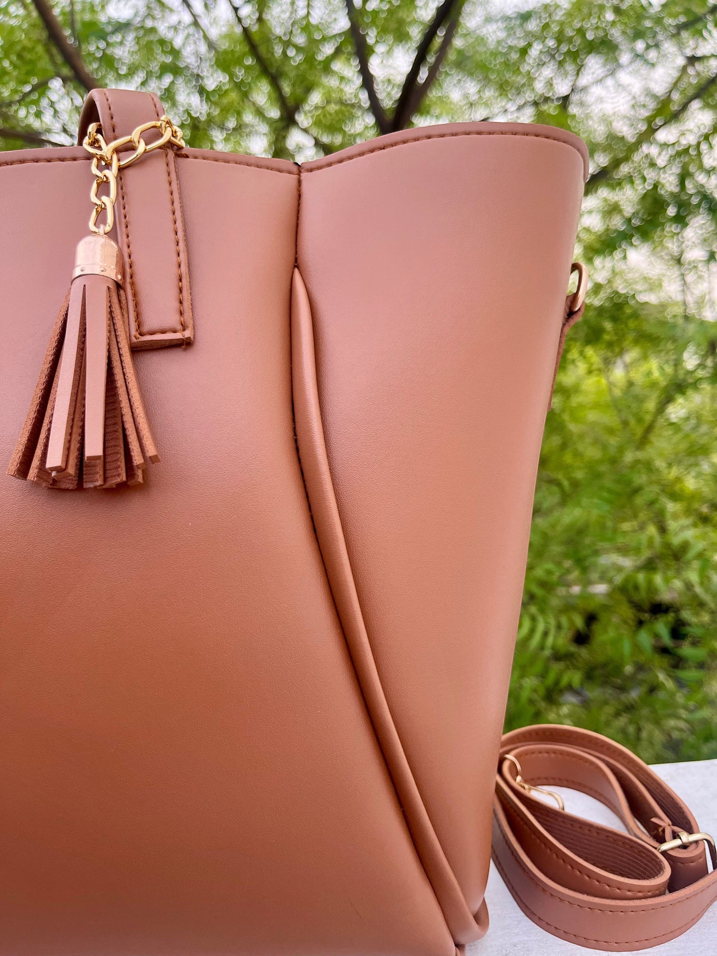 Graciza Aura brown faux leather tote bag with decorative tassel and gold-tone hardware details