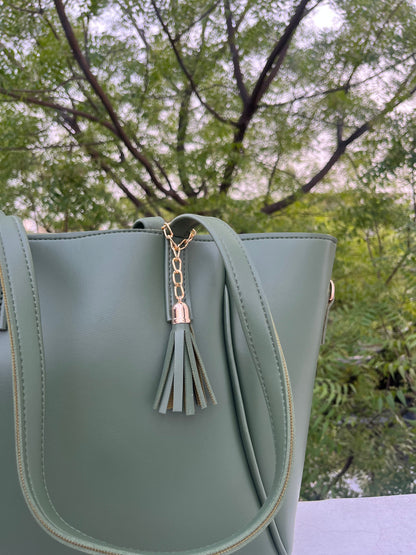 Graciza Aura green faux leather tote bag with gold-tone hardware and a decorative tassel detail.