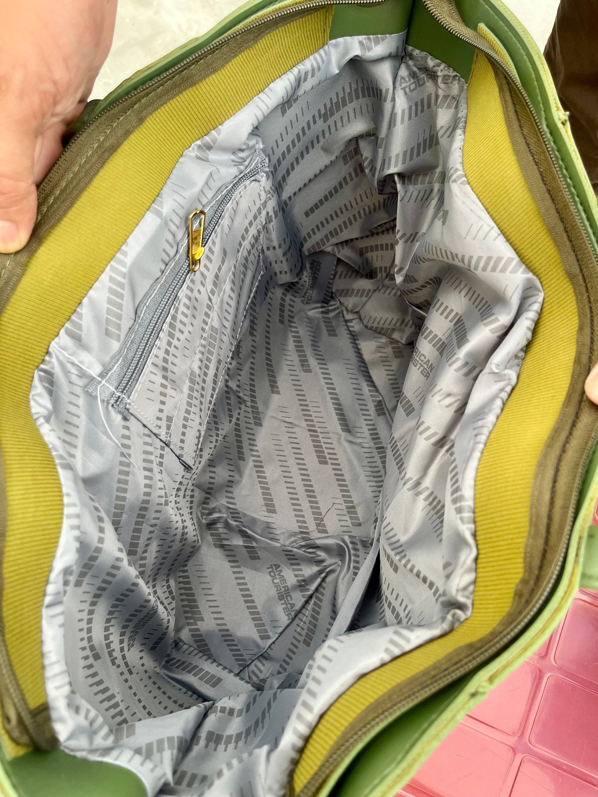 Interior view of the Graciza Aura Tote in green, featuring a spacious compartment with grey patterned lining.