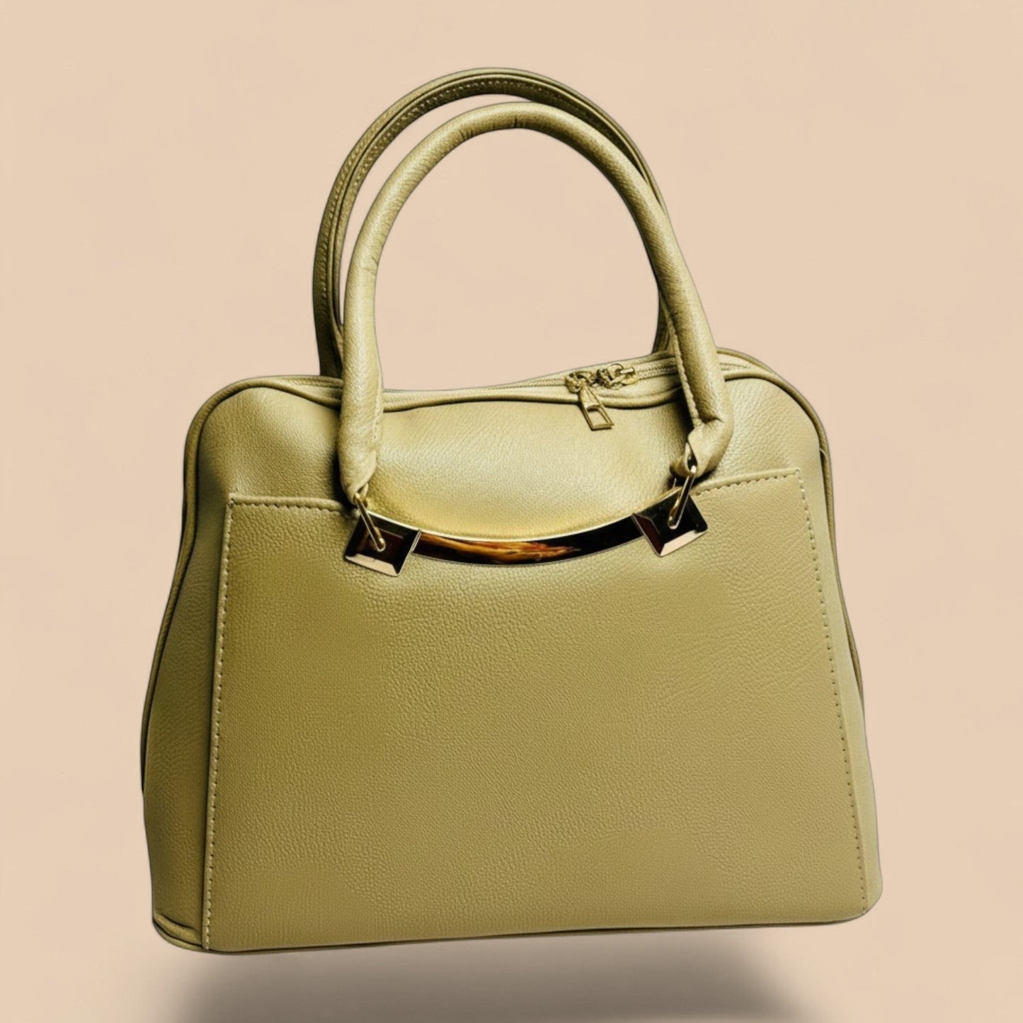 Graciza Elara beige faux leather handbag with twin handles and polished gold hardware accents.