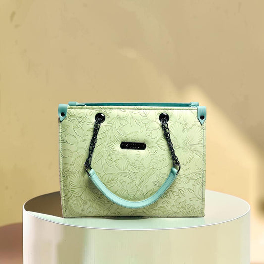 Graciza Flora light mint faux leather shoulder bag with floral embossing, black chain handles, and top-zip closure.