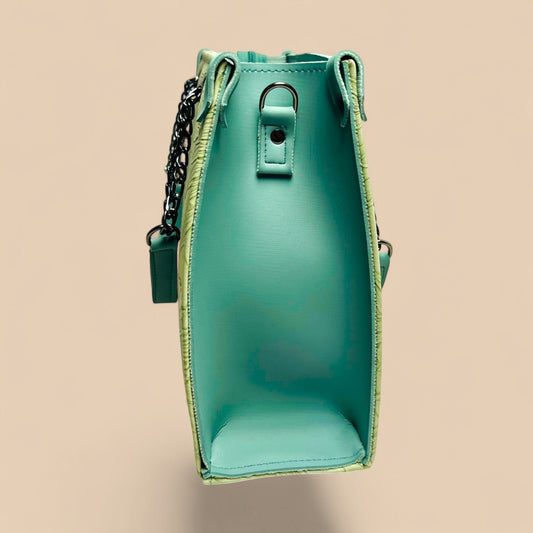Graciza Flora light mint faux leather shoulder bag with textured finish, chain detailing, and adjustable strap.