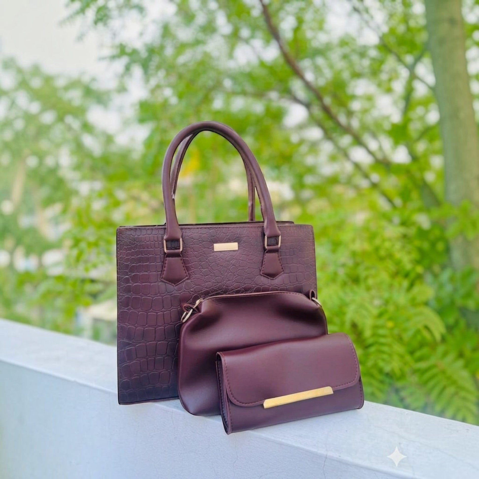 Graciza Lyra burgundy faux leather handbag set with crocodile texture, crossbody bag, and wallet with gold hardware.