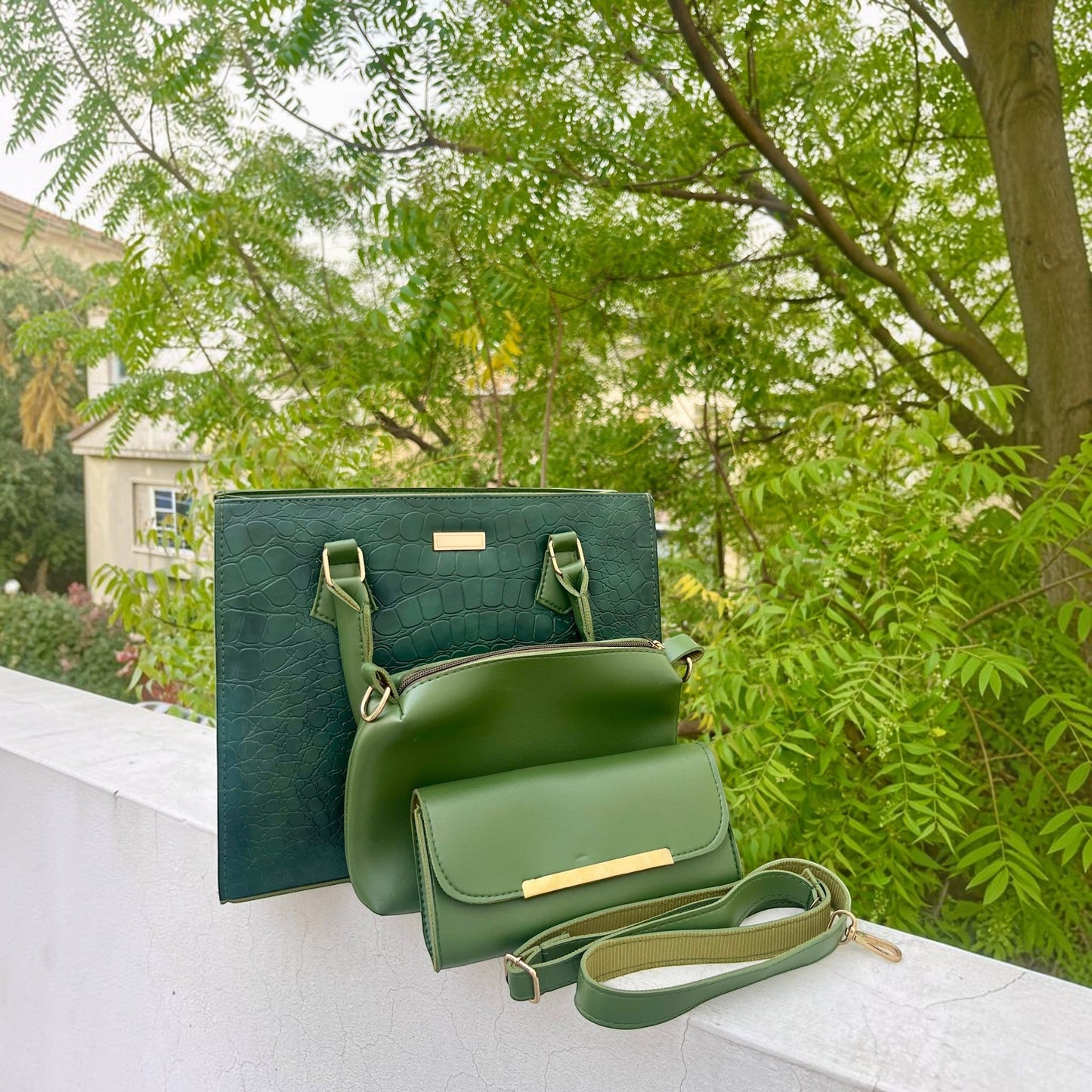Graciza Lyra green faux leather handbag set with crocodile texture, gold hardware, and matching crossbody wallet.