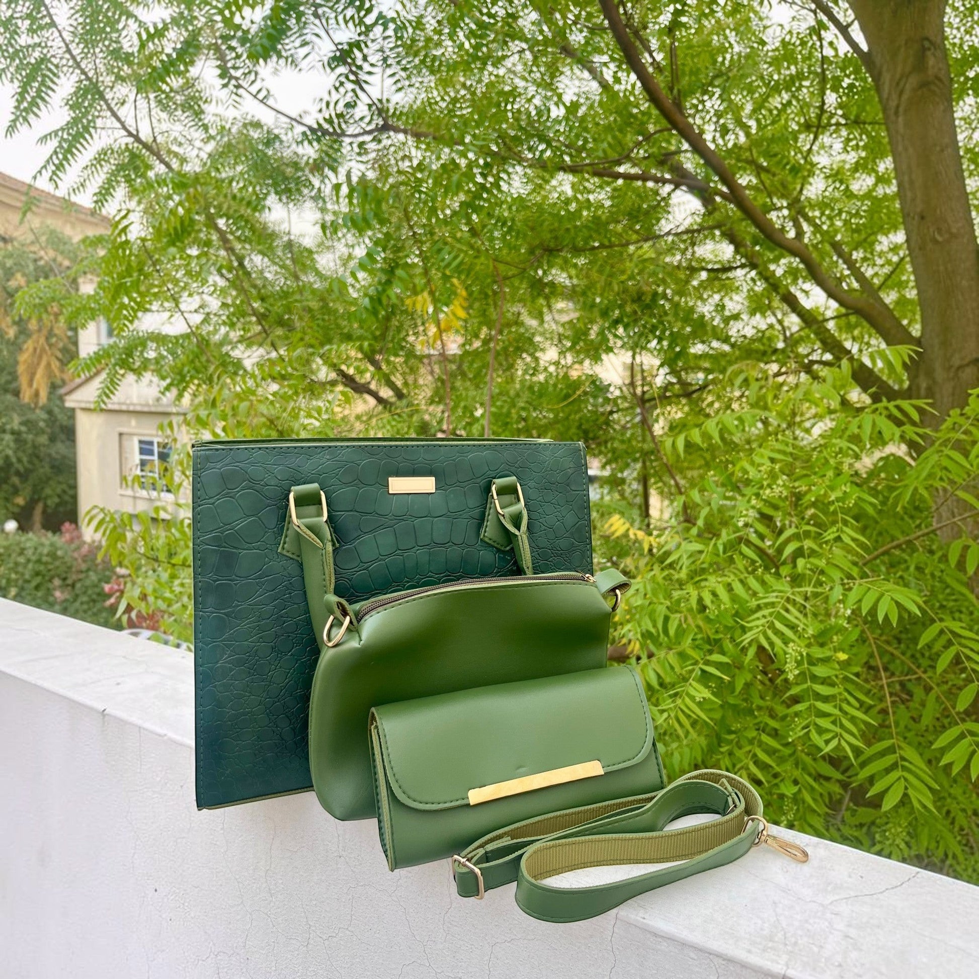 Graciza Lyra green faux leather handbag set with crocodile texture, gold hardware, and matching crossbody wallet.