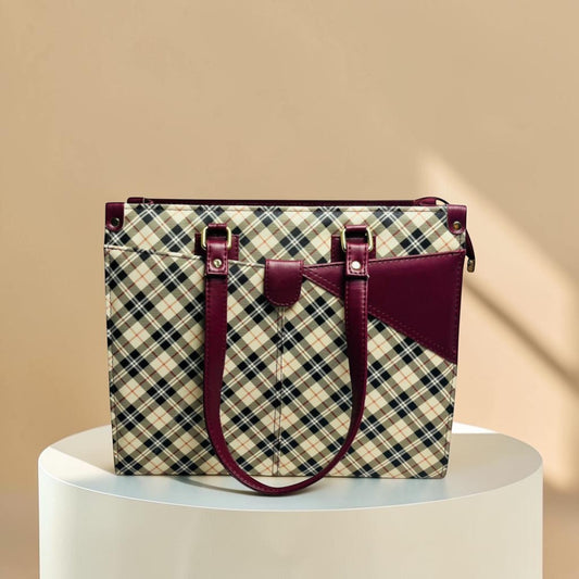 Graciza Nova Tote in maroon and tan checkered faux leather with twin handles and a secure top-zip closure.