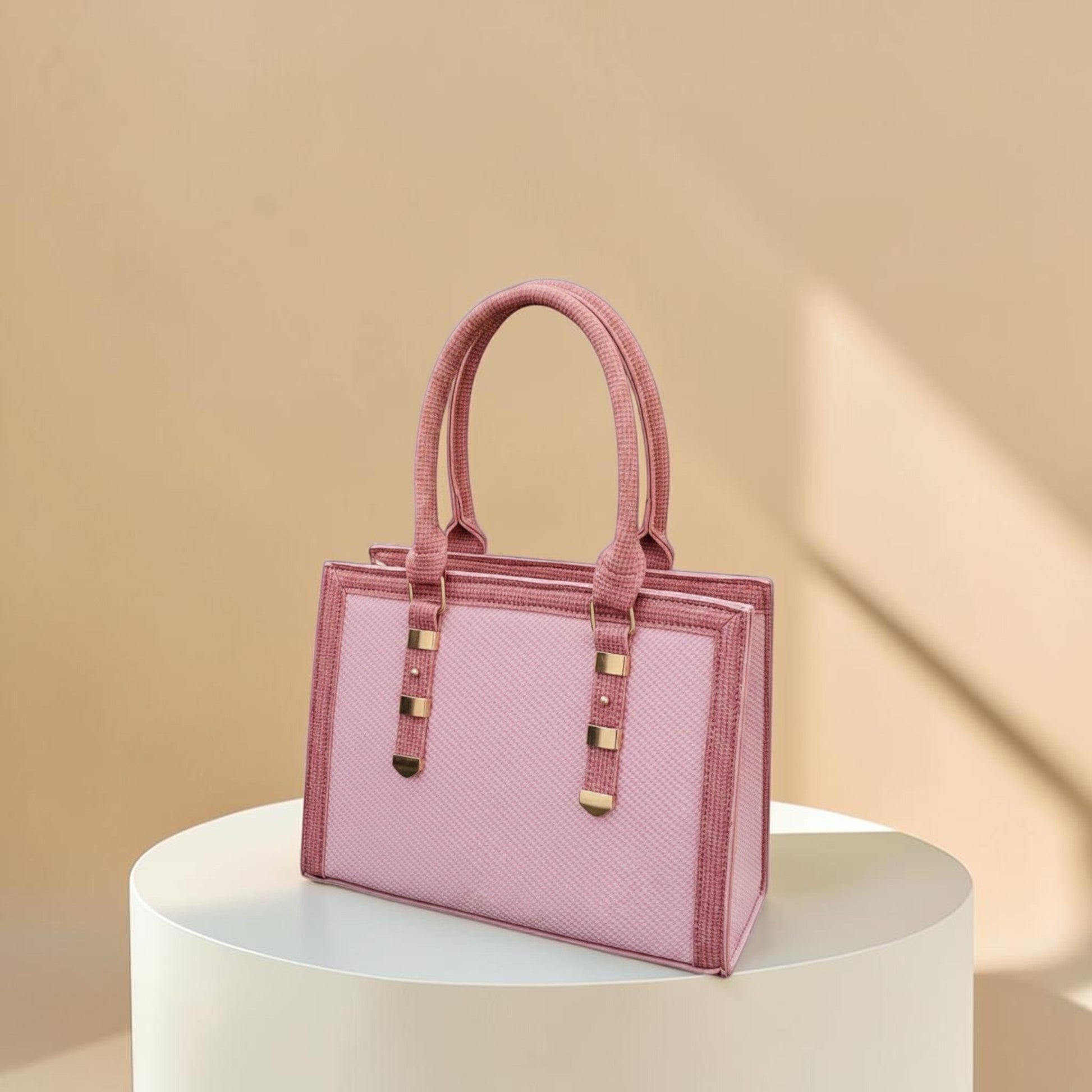 Graciza Sia handbag in two-tone pink faux leather with a structured square design and textured panels.
